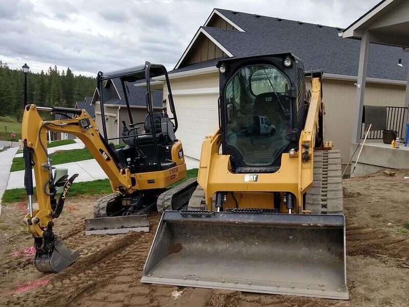 Skid Steer used for gravel spreading and grading in Spokane , Cheney, and Medical Lake, WA